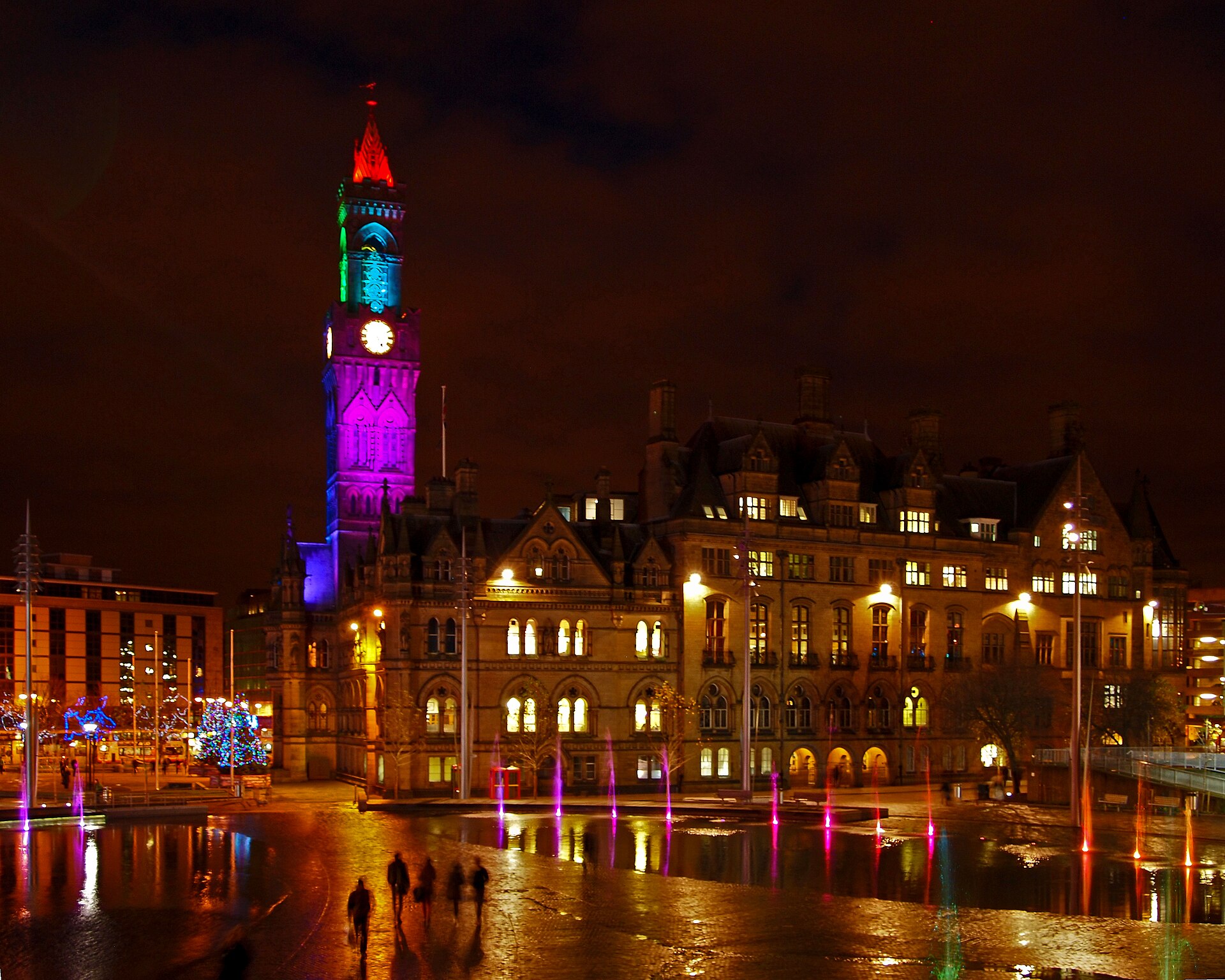 Bradford City Hall and the Mirror Pool illuminated at night